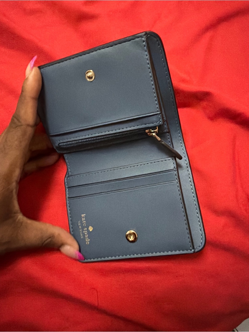 Kate Spade New York blue leather wallet with pebbled texture